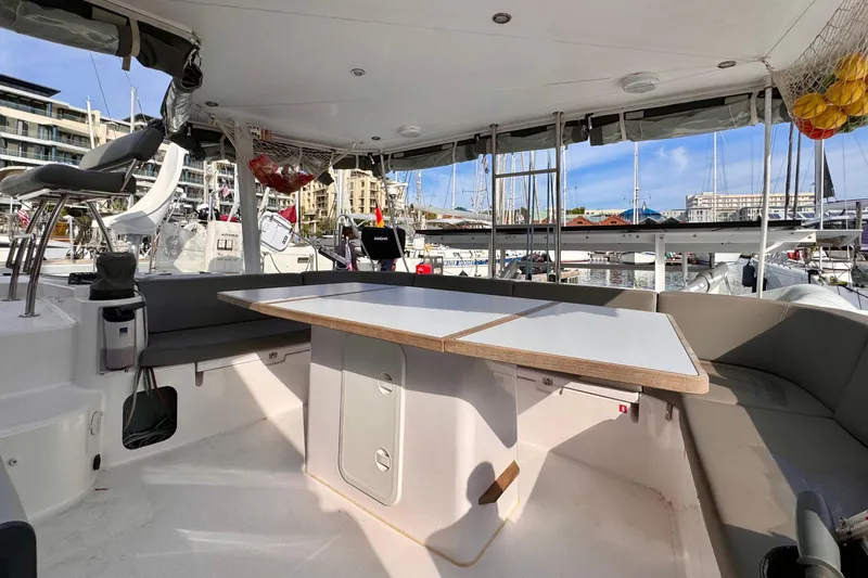 Alegria Yacht Photos Pics Spacious cockpit of 2017 Outremer 51 catamaran docked at marina.