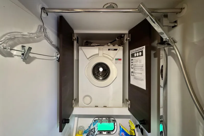 Alegria Yacht Photos Pics Laundry area with washing machine in 2017 Outremer 51 yacht bathroom.