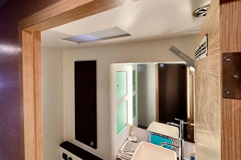 Alegria Yacht Photos Pics Modern bathroom interior of 2017 Outremer 51 yacht with sleek fixtures and wooden accents.