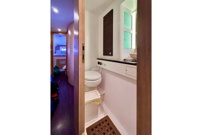 Alegria Yacht Photos Pics Bathroom interior of 2017 Outremer 51 yacht, featuring modern fixtures and wooden accents.