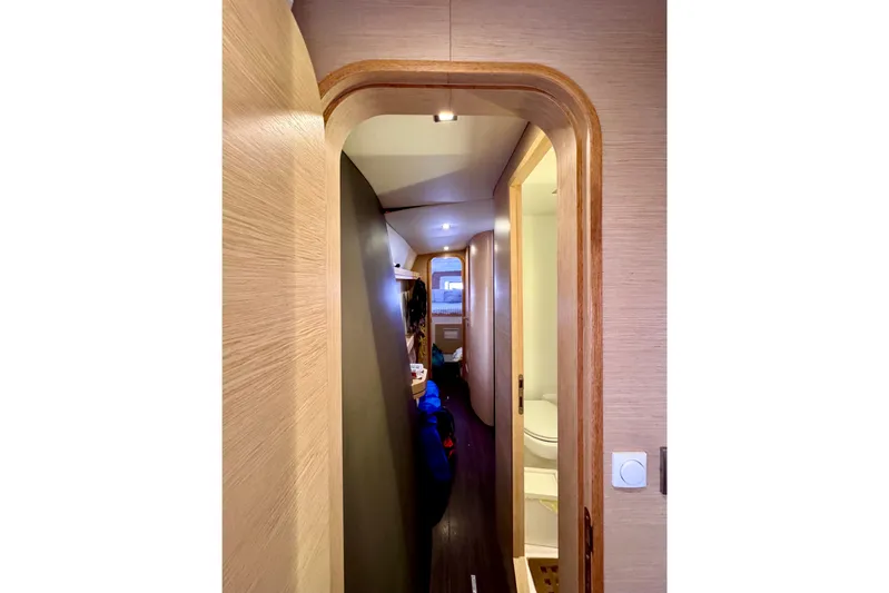 Alegria Yacht Photos Pics Interior hallway of 2017 Outremer 51 yacht, featuring modern wood finishes and compact design.
