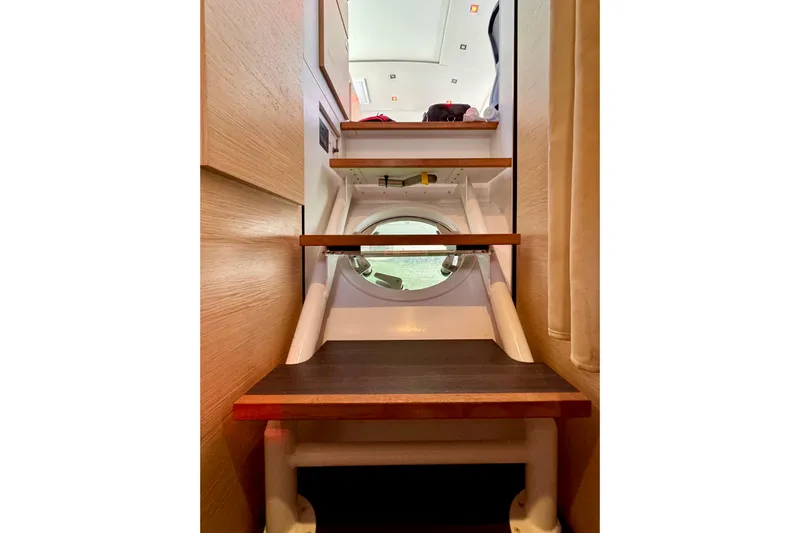 Alegria Yacht Photos Pics Staircase inside 2017 Outremer 51 yacht with porthole view.