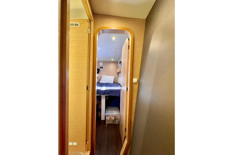 Alegria Yacht Photos Pics Interior view of 2017 Outremer 51 yacht cabin with bed and storage.