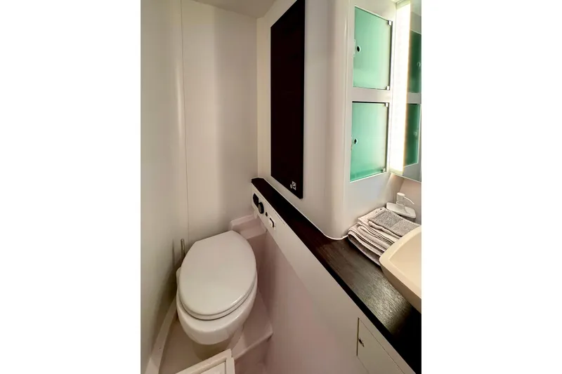 Alegria Yacht Photos Pics Bathroom interior of 2017 Outremer 51 yacht with modern fixtures and storage.