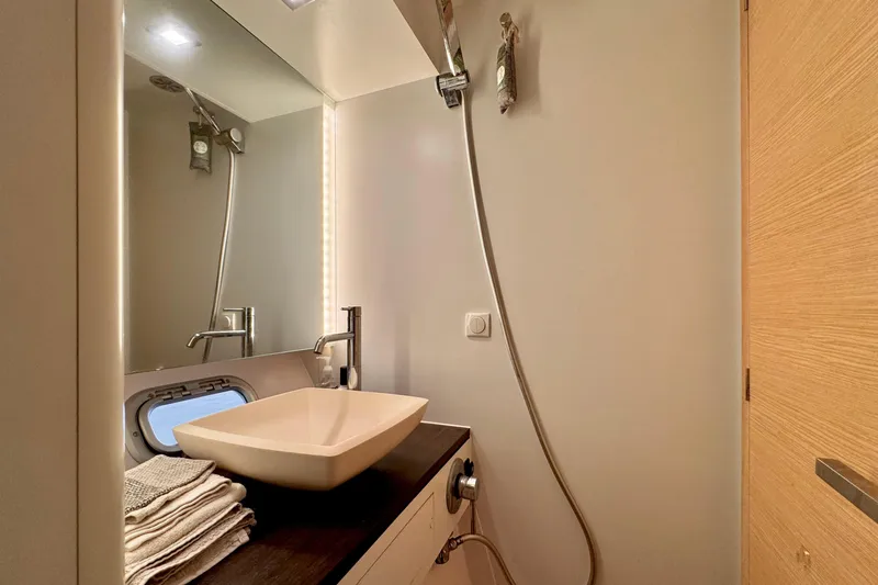 Alegria Yacht Photos Pics Modern bathroom interior on 2017 Outremer 51 yacht, featuring sleek sink and shower.