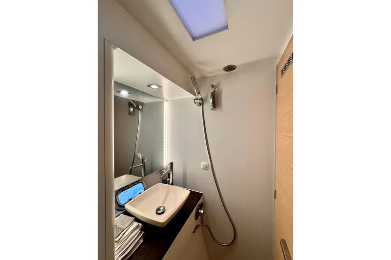 Alegria Yacht Photos Pics Bathroom interior of 2017 Outremer 51 yacht with modern sink and shower.