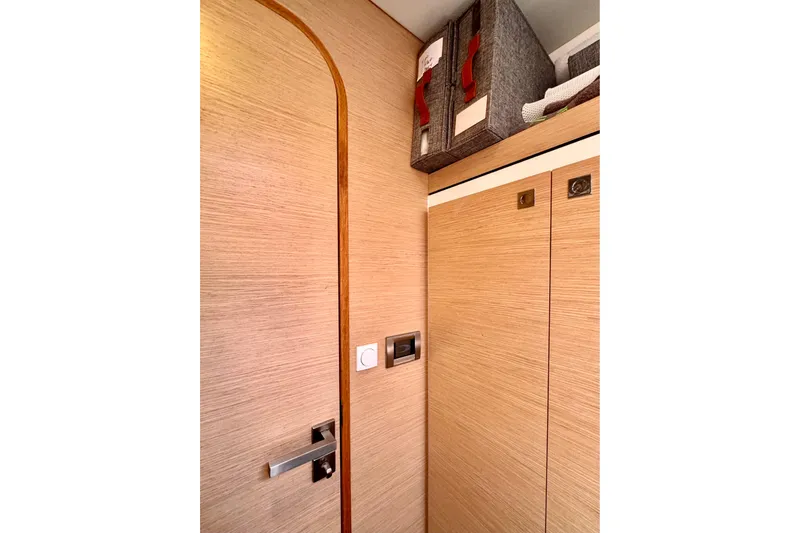 Alegria Yacht Photos Pics Interior of 2017 Outremer 51 yacht with wooden paneling and storage baskets.