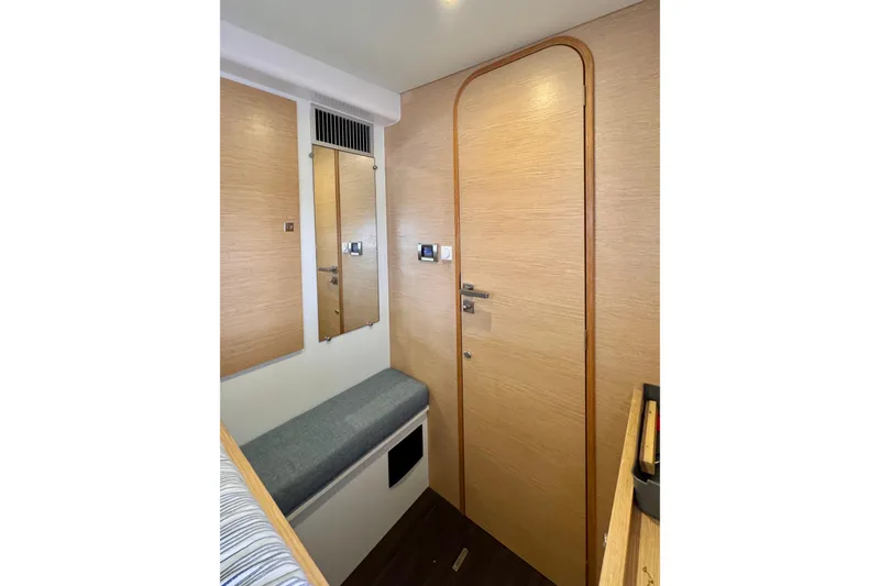 Alegria Yacht Photos Pics Interior of 2017 Outremer 51 yacht with wooden door and seating area.