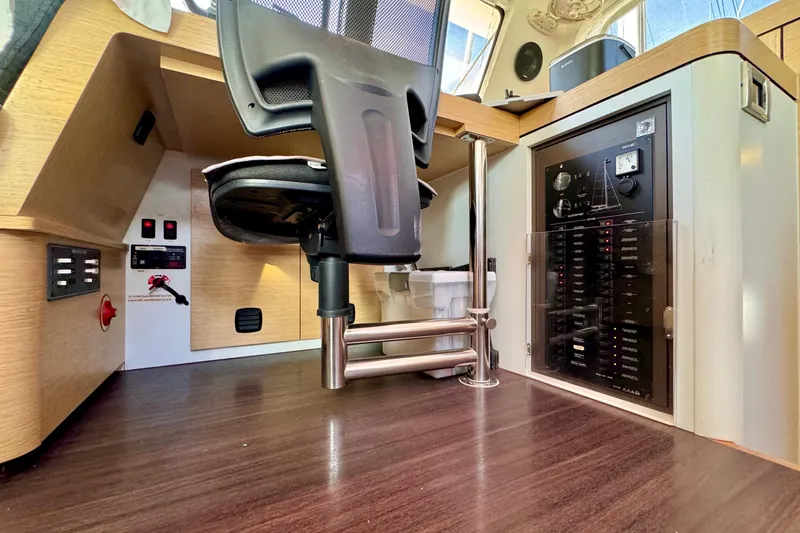 Alegria Yacht Photos Pics Modern interior of 2017 Outremer 51 yacht with control panel and ergonomic chair.
