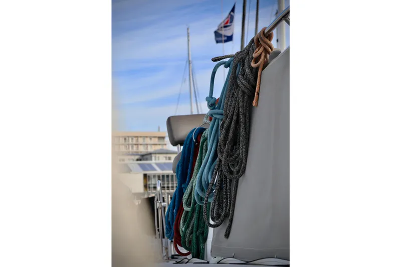 Alegria Yacht Photos Pics Ropes on a 2017 Outremer 51 sailboat, with marina background.