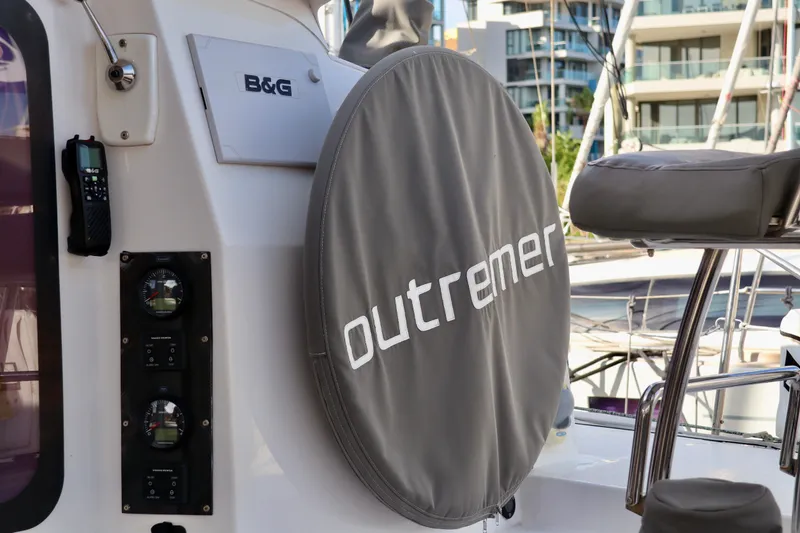 Alegria Yacht Photos Pics 2017 Outremer 51 yacht helm with cover, B&G equipment, marina background.