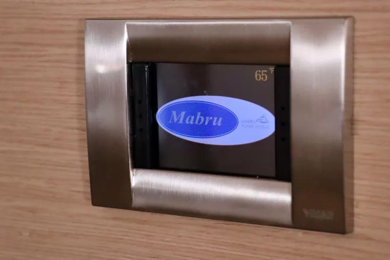 Alegria Yacht Photos Pics Mabru power system display on 2017 Outremer 51 yacht, showing temperature at 65&deg;F.