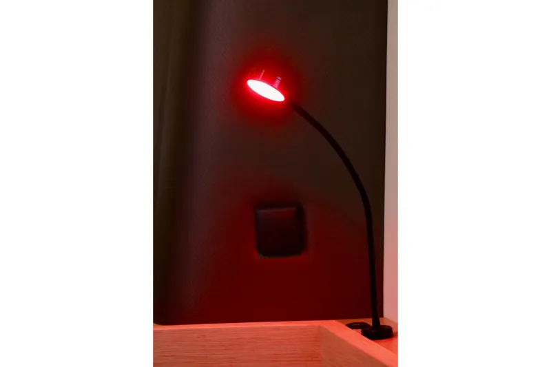 Alegria Yacht Photos Pics Red reading light on Outremer 51 yacht, 2017 model, illuminating a dark interior.