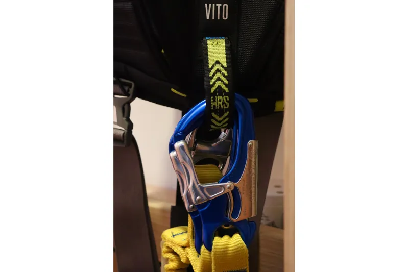 Alegria Yacht Photos Pics Safety harness with blue carabiner and yellow strap, labeled "Vito" and "HRS."