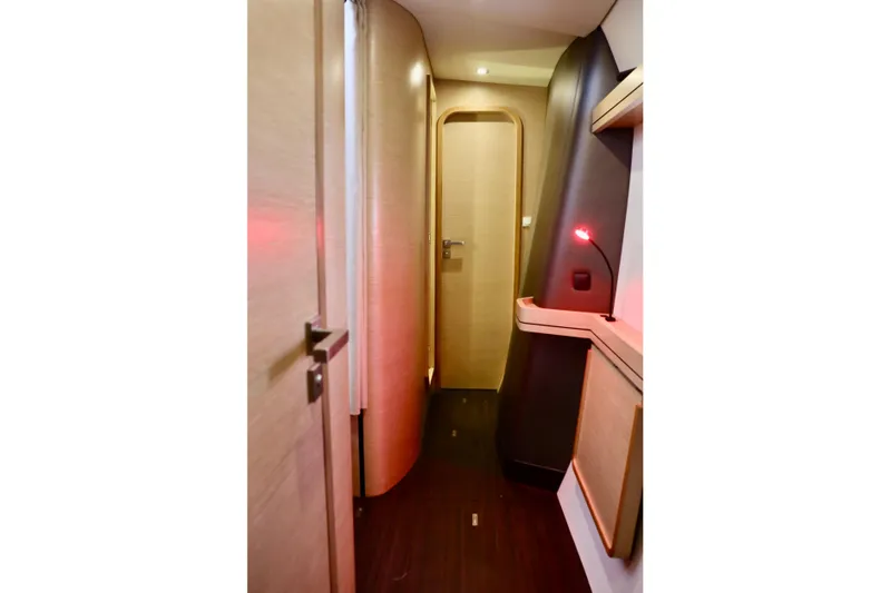 Alegria Yacht Photos Pics 2017 Outremer 51 yacht interior hallway with modern wood finish and ambient lighting.