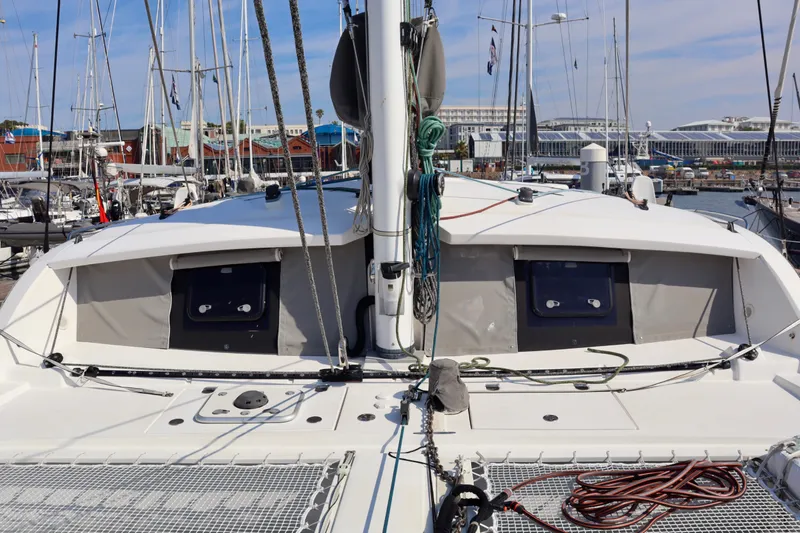Alegria Yacht Photos Pics 2017 Outremer 51 catamaran docked at a marina, showcasing deck and rigging.
