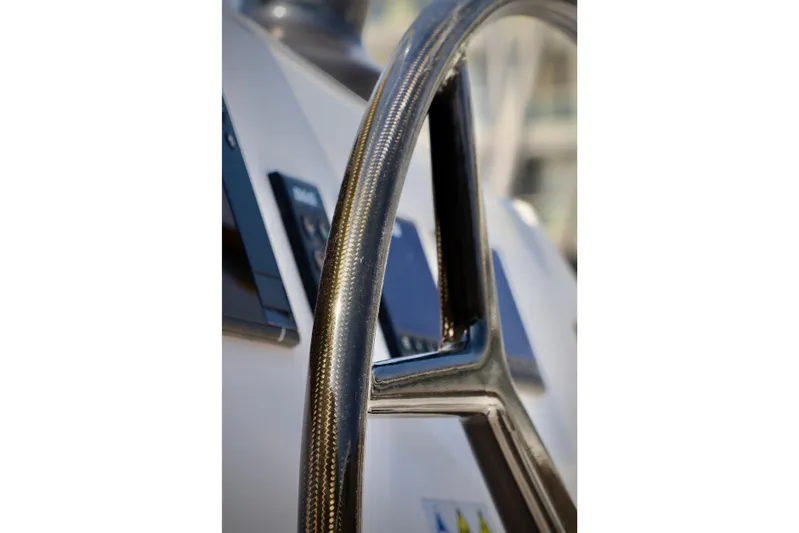Alegria Yacht Photos Pics Close-up of 2017 Outremer 51 yacht steering wheel, showcasing sleek design.