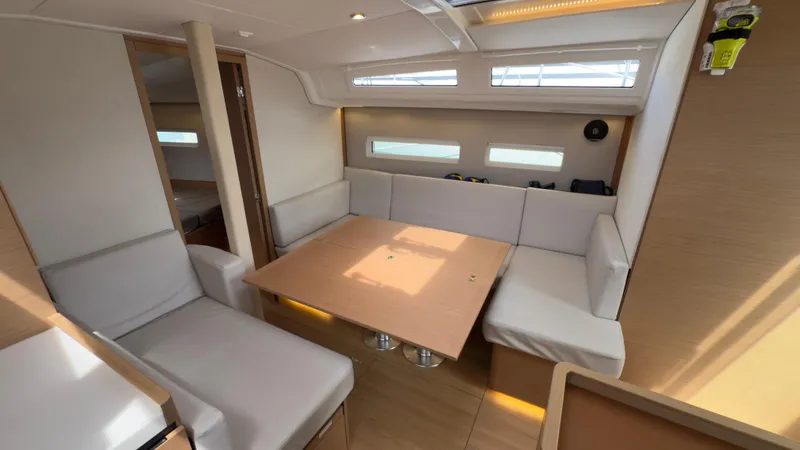  Yacht Photos Pics Modern interior of 2022 Jeanneau Sun Odyssey 410 yacht with spacious seating and natural light.