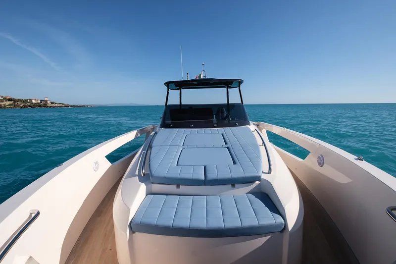 400 Wa Yacht Photos Pics 2025 Cayman Yachts 400 WA cruising on clear blue waters under a sunny sky.