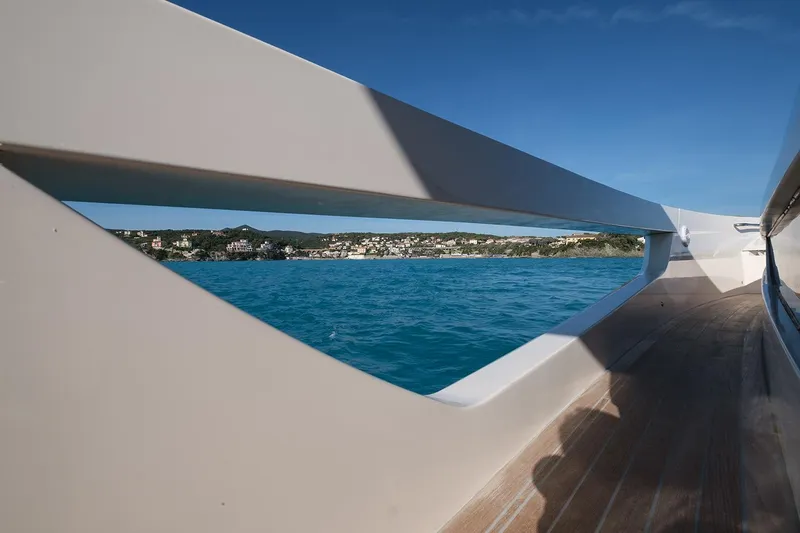 400 Wa Yacht Photos Pics View from Cayman Yachts 400 WA 2025, overlooking serene blue waters and distant coastline.