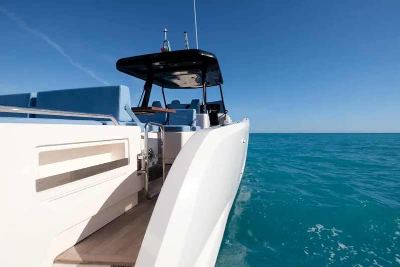 400 Wa Yacht Photos Pics 2025 Cayman Yachts 400 WA cruising on clear blue ocean waters.