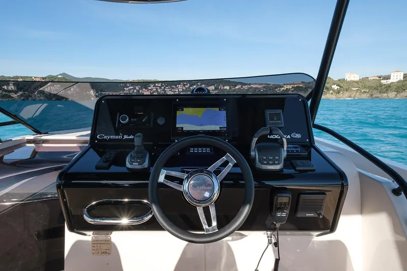 400 Wa Yacht Photos Pics Helm of 2025 Cayman Yachts 400 WA with navigation controls and sea view.