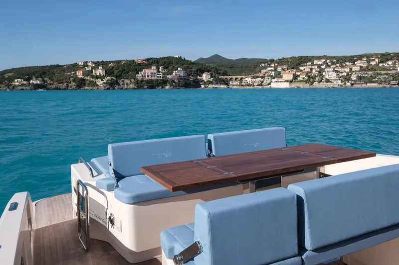 400 Wa Yacht Photos Pics Luxury Cayman Yachts 400 WA, 2025 model, with scenic coastal view and elegant seating.