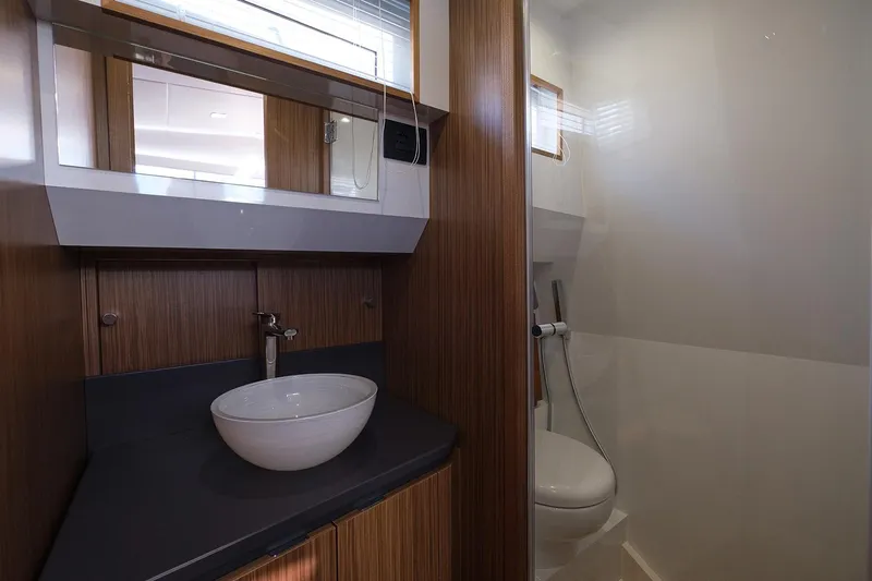 400 Wa Yacht Photos Pics Luxurious bathroom in 2025 Cayman Yachts 400 WA, featuring modern sink and toilet.