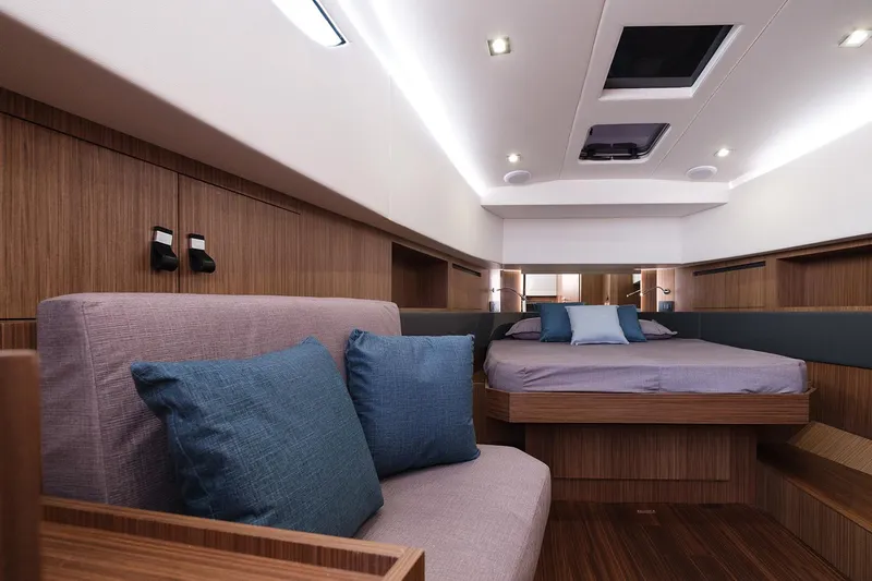 400 Wa Yacht Photos Pics Luxurious interior of 2025 Cayman Yachts 400 WA with modern wood finish and cozy seating.