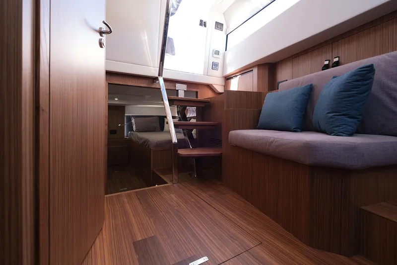 400 Wa Yacht Photos Pics Luxurious interior of 2025 Cayman Yachts 400 WA with wooden finish and cozy seating.