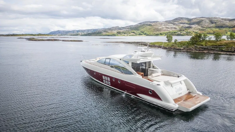  Yacht Photos Pics 2008 Azimut 62S yacht cruising on a serene lake with scenic mountain backdrop.