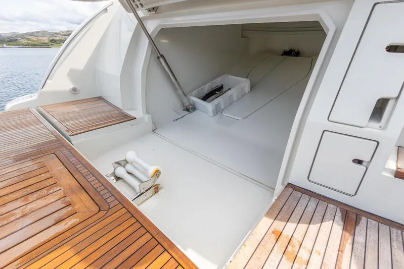  Yacht Photos Pics 2008 Azimut 62S yacht storage compartment with wooden deck and open hatch.