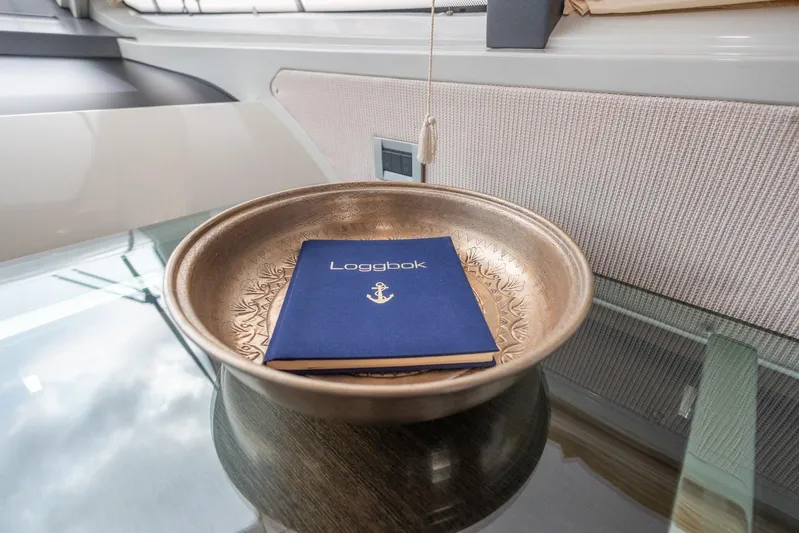  Yacht Photos Pics Logbook in decorative bowl on Azimut 62S yacht, 2008 model.