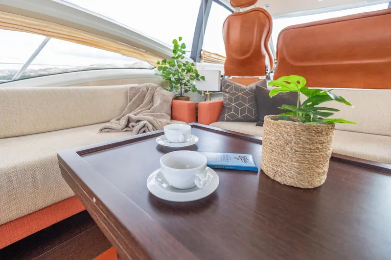  Yacht Photos Pics Luxurious interior of 2008 Azimut 62S yacht with cozy seating and elegant decor.