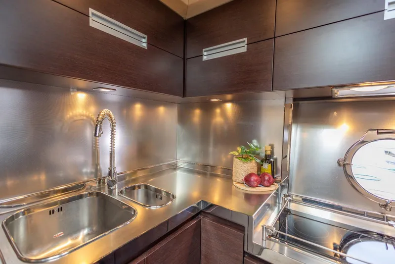  Yacht Photos Pics Luxurious kitchen in 2008 Azimut 62S yacht with modern fixtures and sleek design.