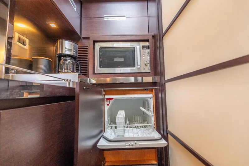  Yacht Photos Pics Modern kitchen in 2008 Azimut 62S yacht with microwave, coffee maker, and dishwasher.