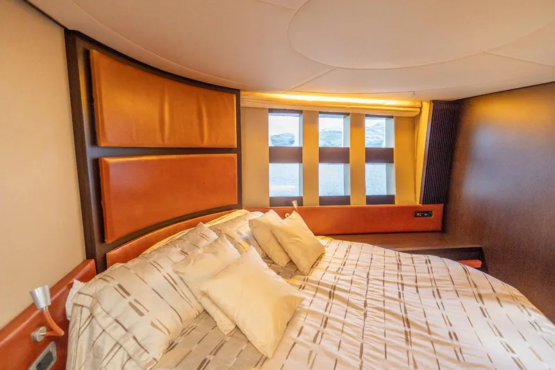  Yacht Photos Pics Luxurious bedroom interior of 2008 Azimut 62S yacht with elegant design and comfortable bedding.