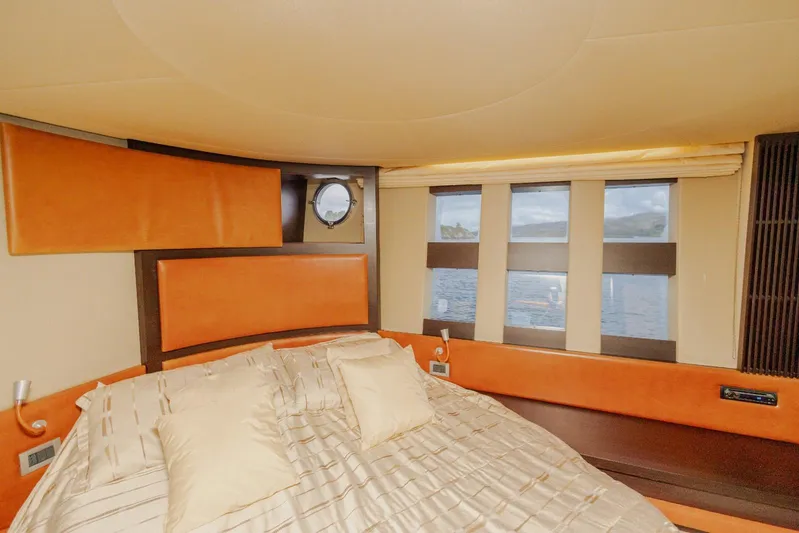  Yacht Photos Pics Luxurious bedroom interior of 2008 Azimut 62S yacht with elegant design and scenic window view.