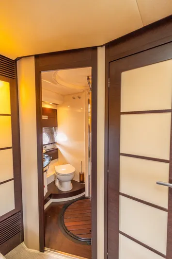  Yacht Photos Pics Luxurious bathroom interior of 2008 Azimut 62S yacht, featuring modern design and wooden accents.