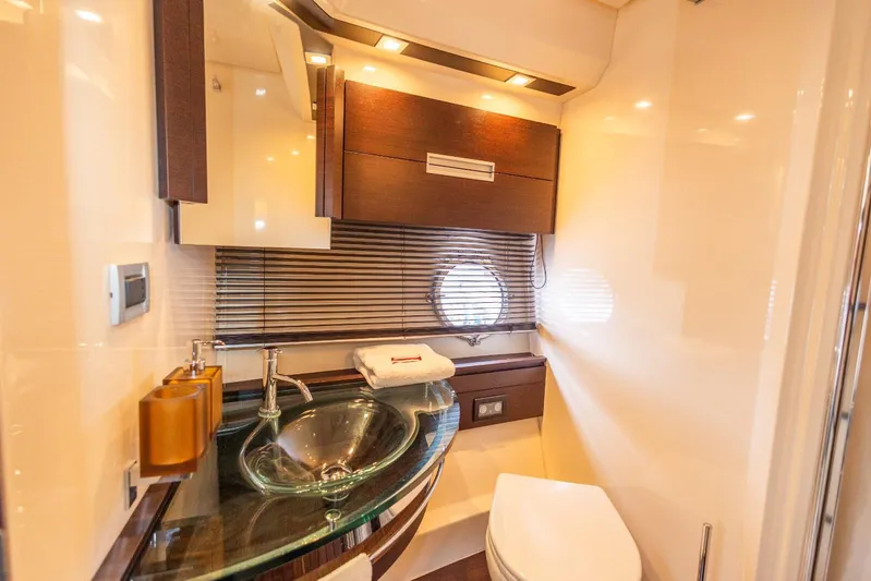  Yacht Photos Pics Luxurious bathroom in 2008 Azimut 62S yacht with modern fixtures and elegant design.