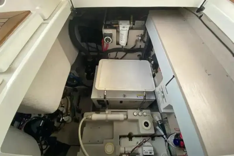  Yacht Photos Pics Engine compartment of a 2013 Searay 370 Venture boat, showcasing mechanical components.