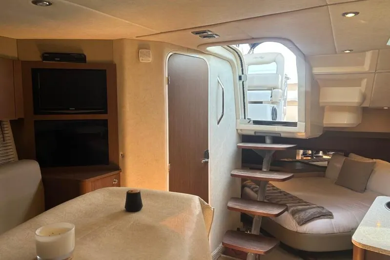  Yacht Photos Pics 2013 Searay 370 Venture interior with cozy seating, TV, and modern design.