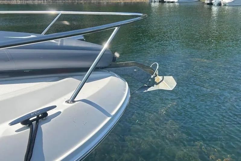  Yacht Photos Pics 2013 Searay 370 Venture boat anchored on clear water.