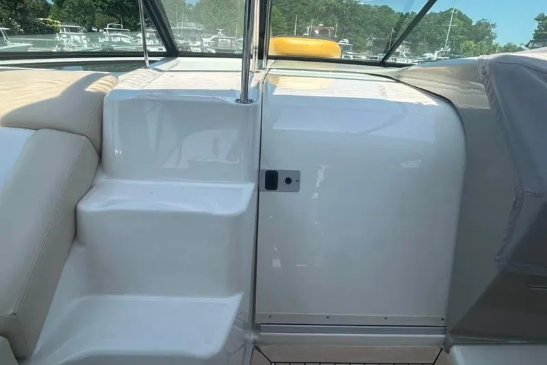  Yacht Photos Pics 2013 Searay 370 Venture boat interior with steps and seating, docked at marina.