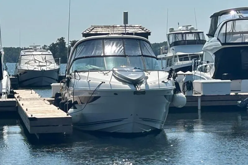  Yacht Photos Pics 2013 Searay 370 Venture docked at marina, surrounded by other boats.