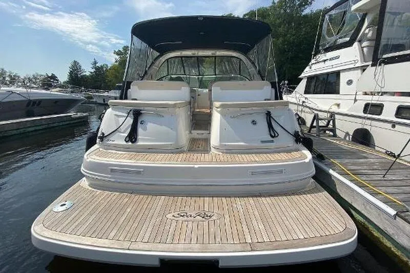  Yacht Photos Pics 2013 Searay 370 Venture boat docked, featuring spacious rear deck and seating.