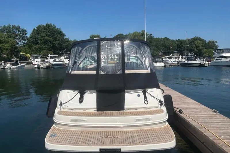  Yacht Photos Pics 2013 Searay 370 Venture docked at marina, featuring sleek design and covered cockpit.