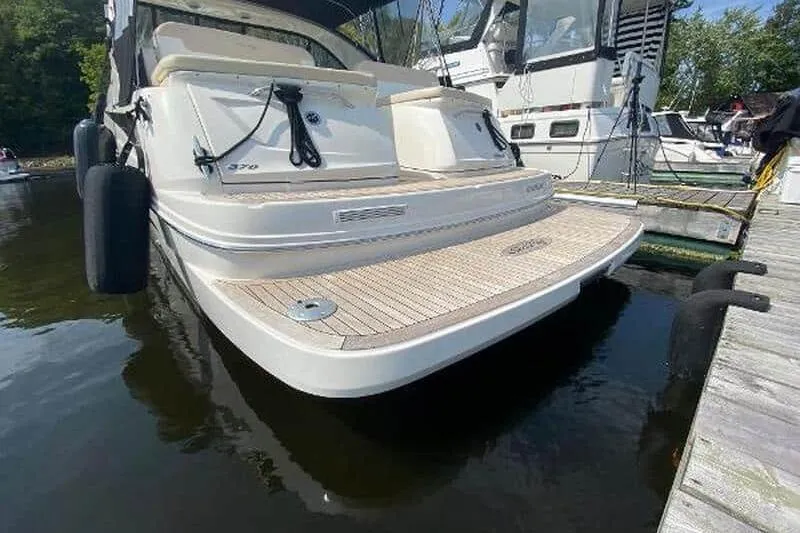  Yacht Photos Pics 2013 Searay 370 Venture yacht docked, showcasing rear deck and sleek design.