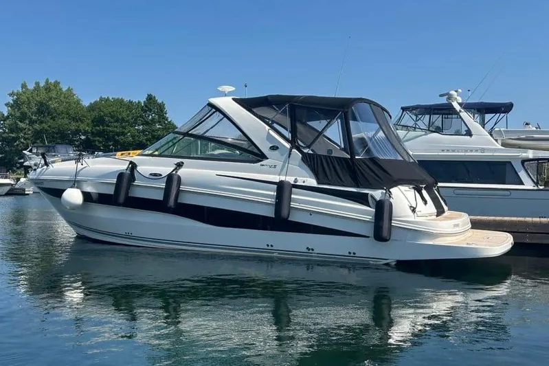  Yacht Photos Pics 2013 Searay 370 Venture boat docked in a marina on a sunny day.