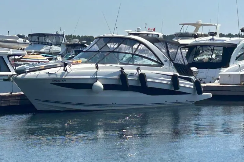  Yacht Photos Pics 2013 Searay 370 Venture yacht docked in a marina, surrounded by other boats.